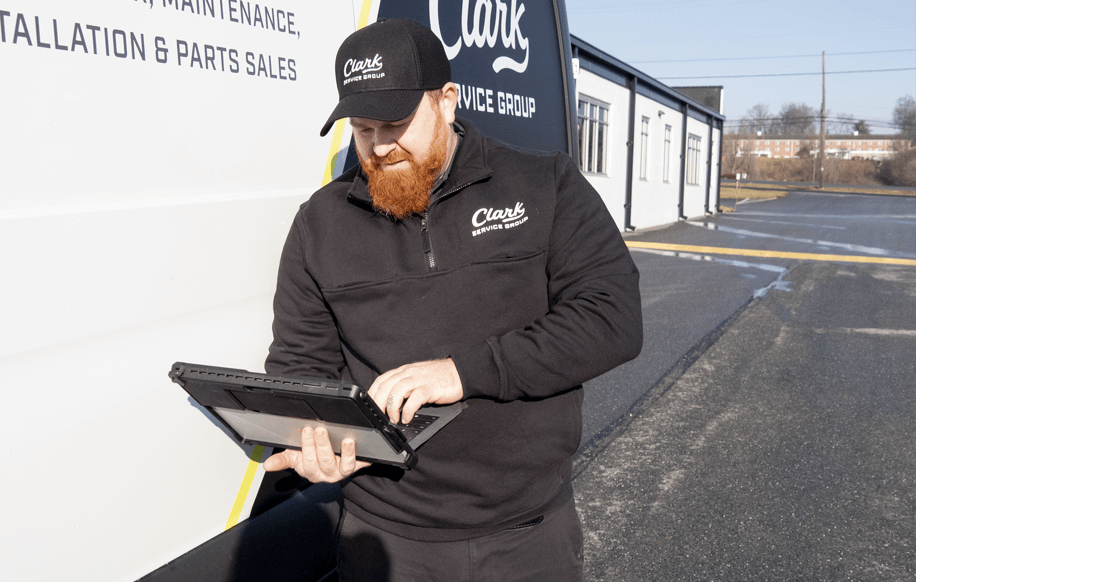 Clark Service Group technician researching parts.